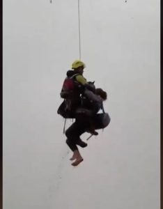 Woman and Her Dog Rescued from Floods in Spain